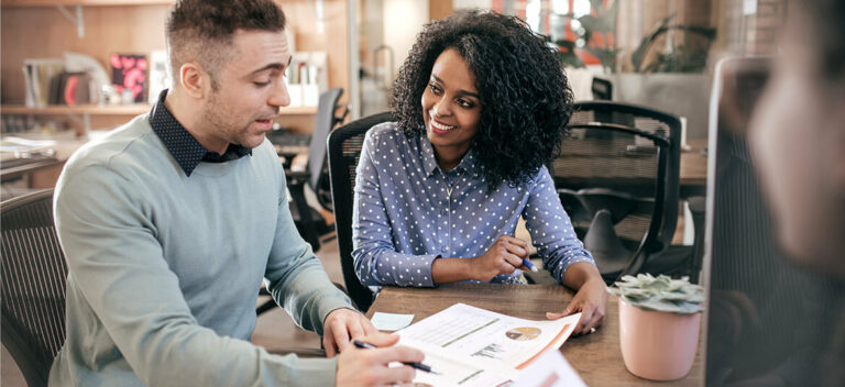business managers discussing pricing strategies